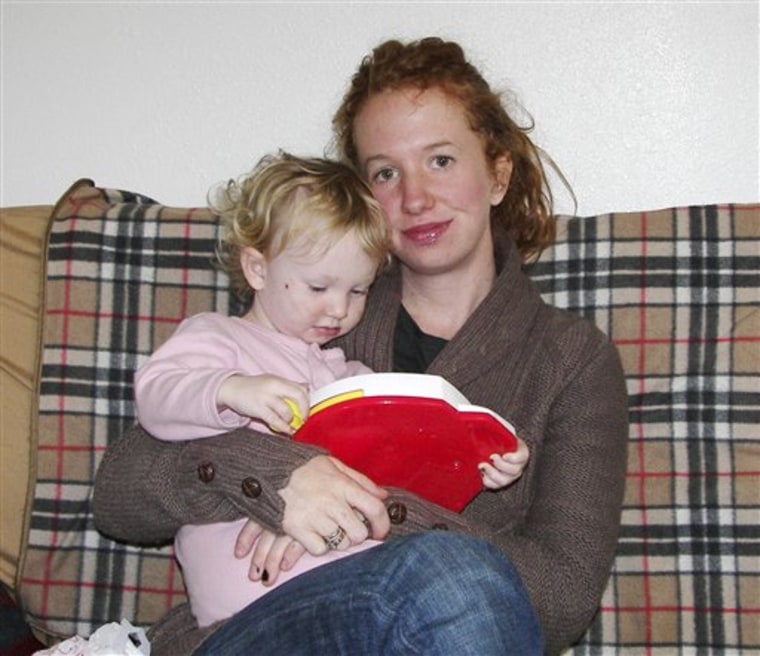 In this undated photo provided by Emily Gillette, she is shown with daughter, River. Gillette, who was asked to leave an airplane for breast-feeding her child in 2006, sparking a day of airport protests nationwide, has reached an out-of-court settlement with the airlines she sued. 